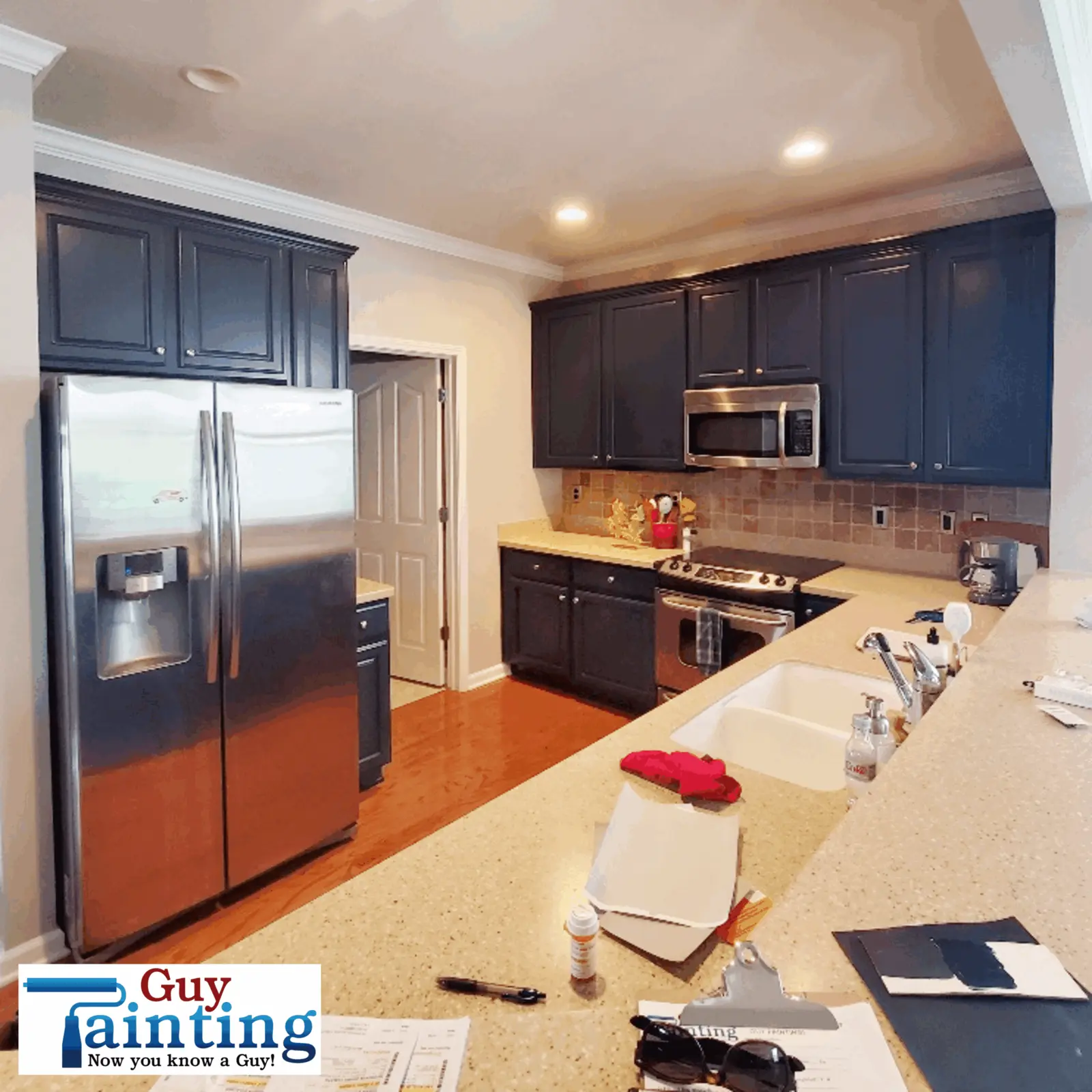 Blue painted cabinets in Fishers using Sherwin-Williams Naval on kitchen cabinets