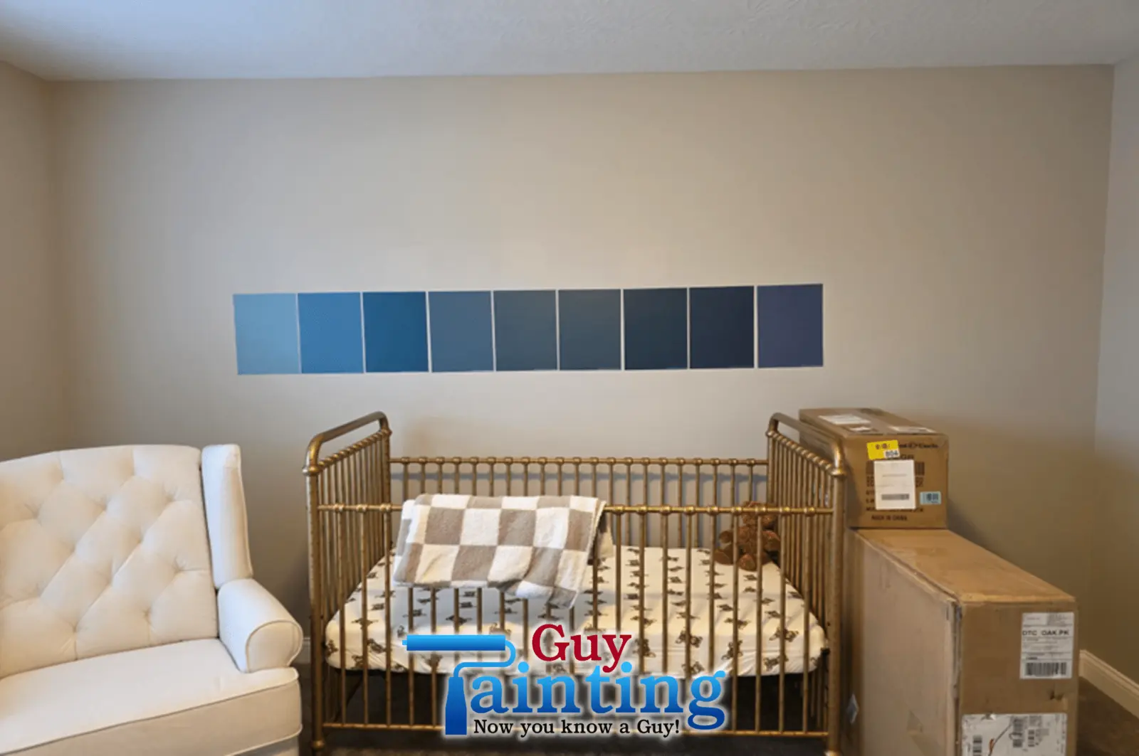 Fishers nursery before Guy Painting's update — plain beige wall with navy paint swatches above the crib