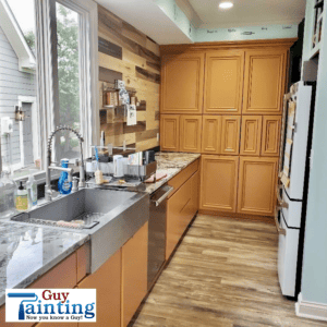 Cabinet painter in Geist painted kitchen cabinets in light brown orange color