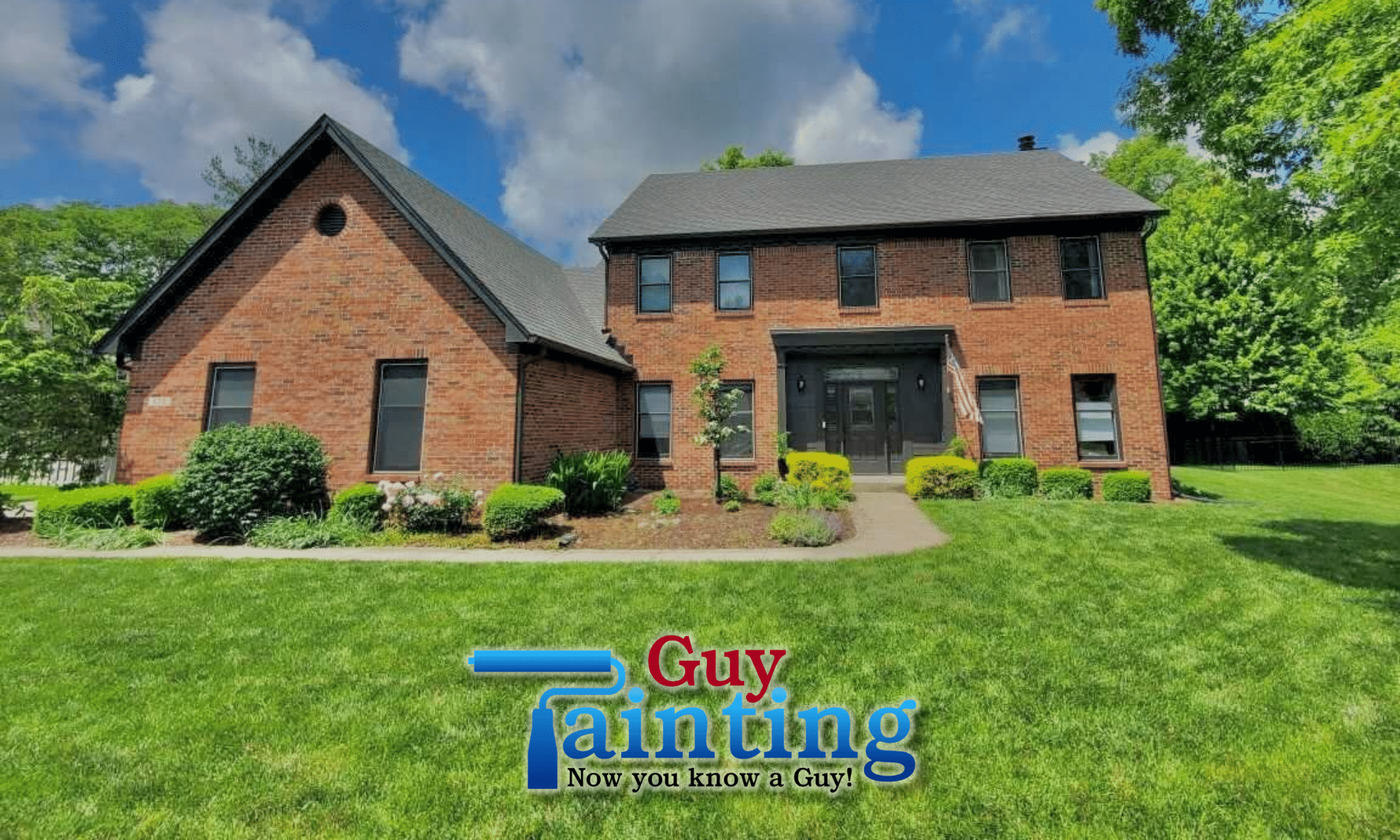North Indianapolis brick home exterior after repaint by Guy Painting — Iron Ore black trim and siding